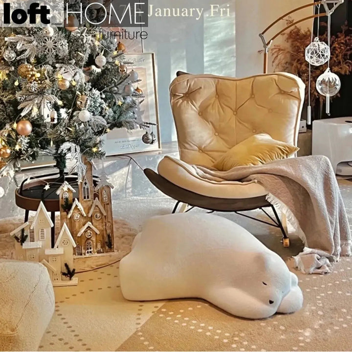 Contemporary velvet ottoman resting bear white in real life style.