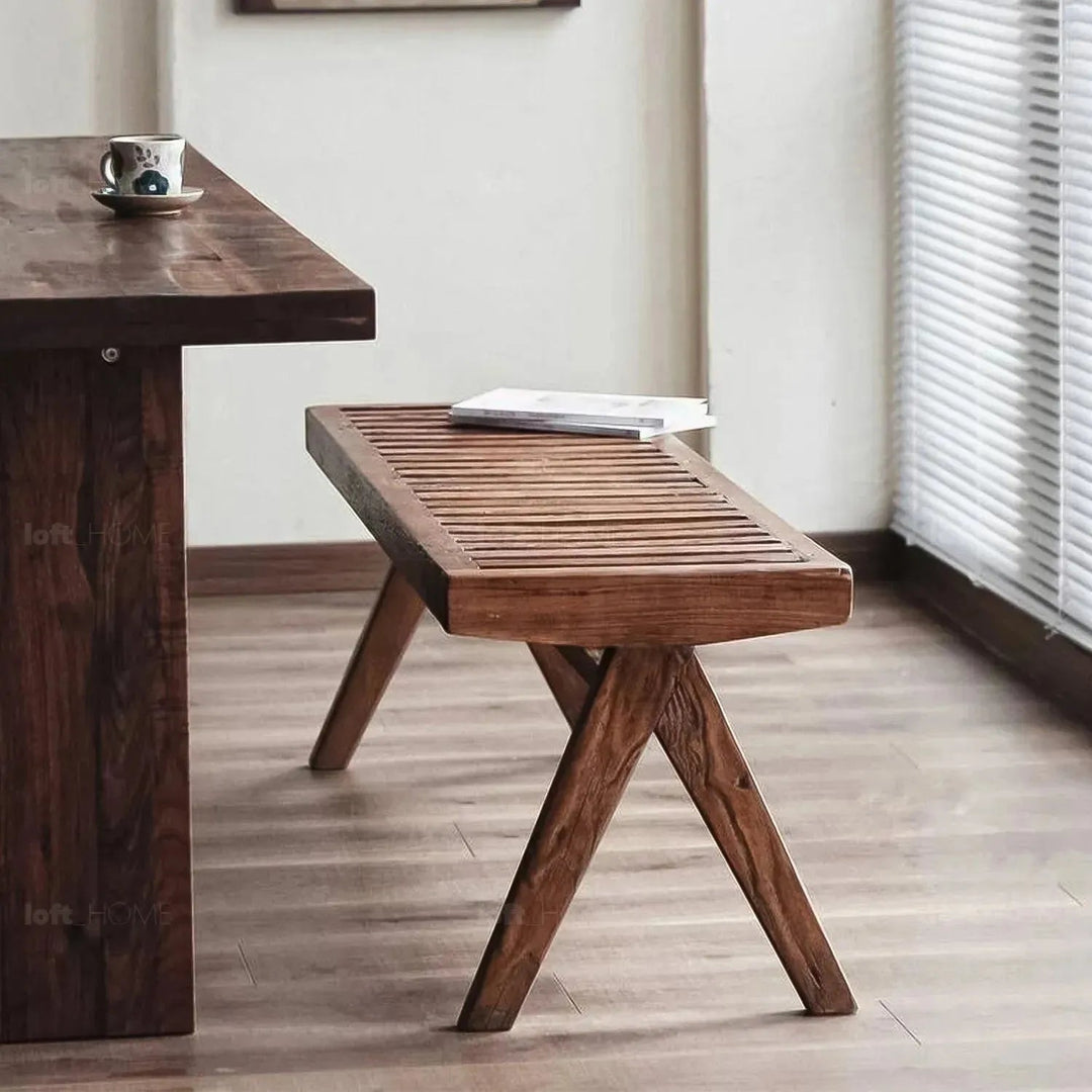Rustic elm wood dining bench shadow elm in close up details.