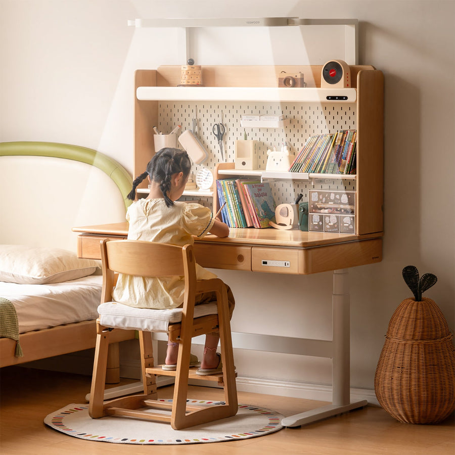 Scandinavian beech wood electric height adjustable kids study table with intergrated led light orbita primary product view.