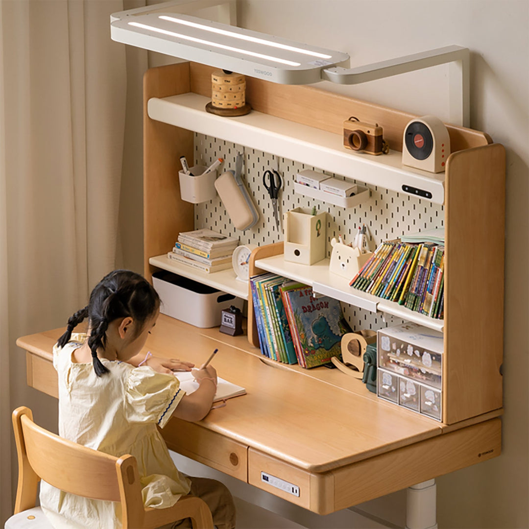 Scandinavian beech wood electric height adjustable kids study table with intergrated led light orbita in close up details.