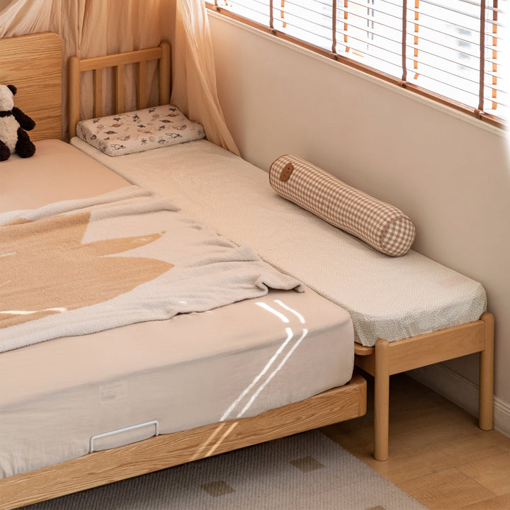 Scandinavian beech wood height adjustable kids sidecar bed with mattress anchor with context.