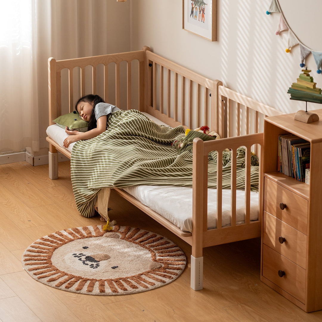 Scandinavian beech wood height adjustable kids sidecar bed with mattress set sova in close up details.