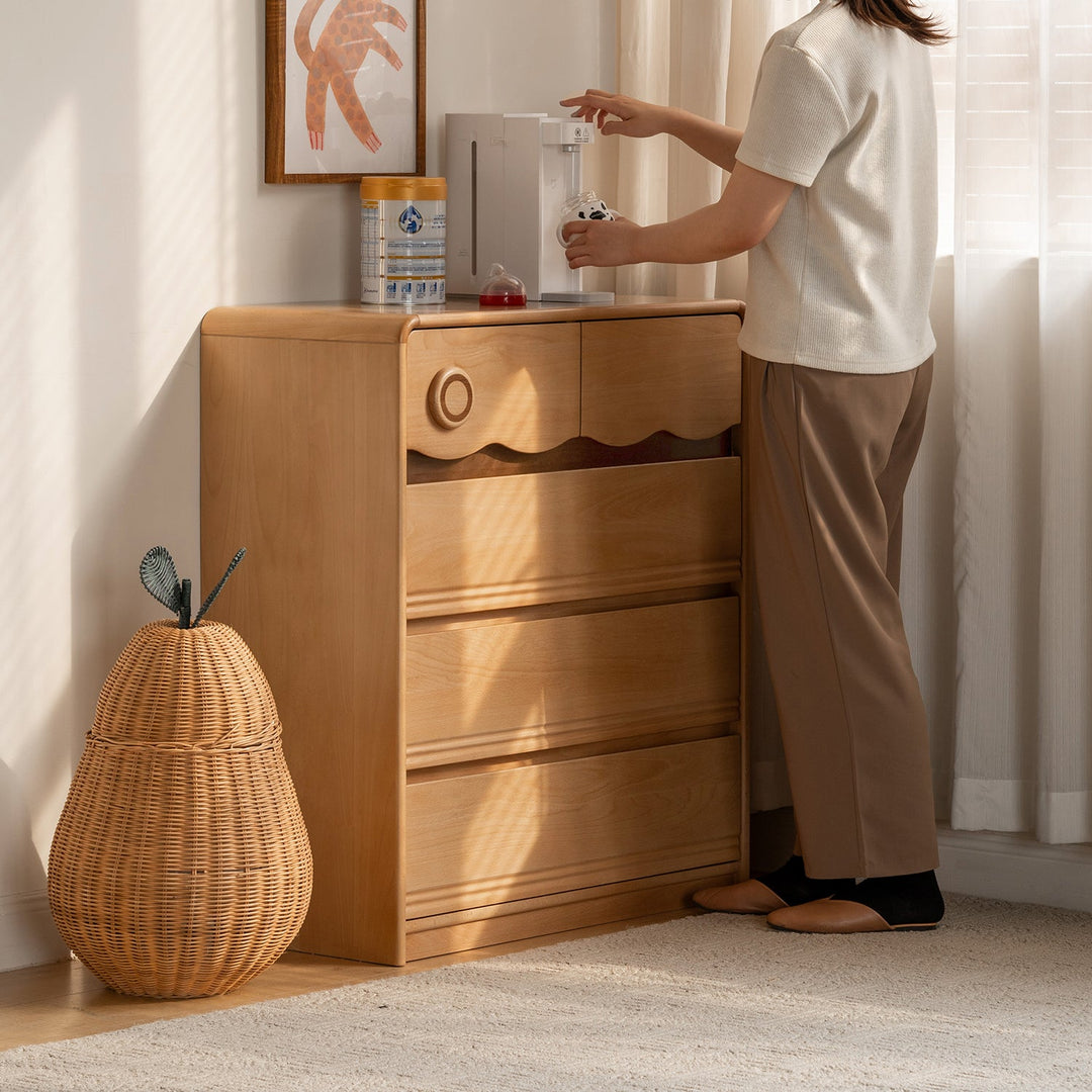 Scandinavian beech wood kids chest of drawers creamy in details.