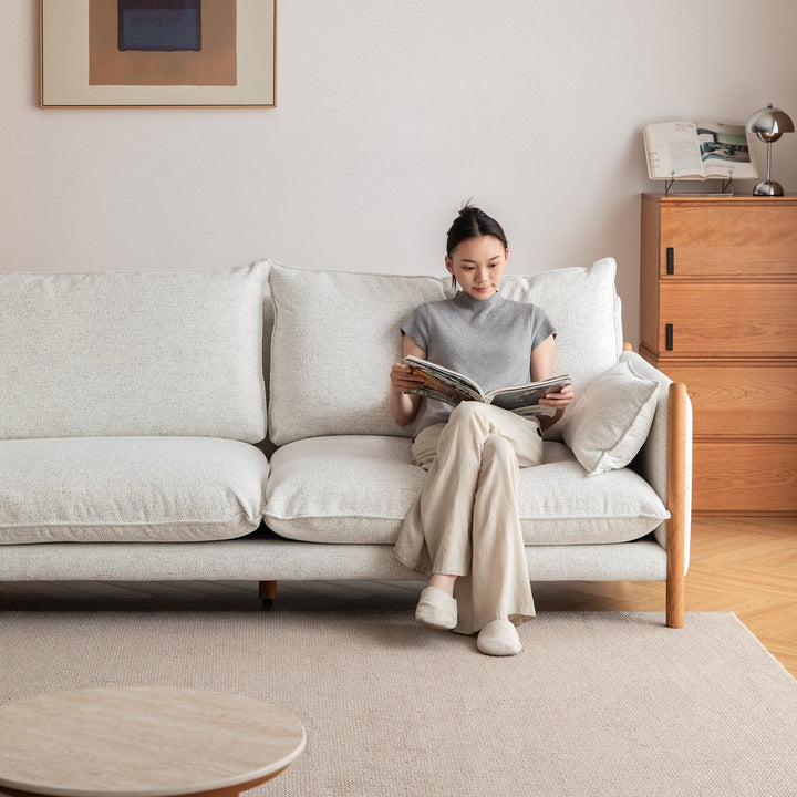 Scandinavian chenille velvet cherry wood 4 seater sofa sea salt in close up details.