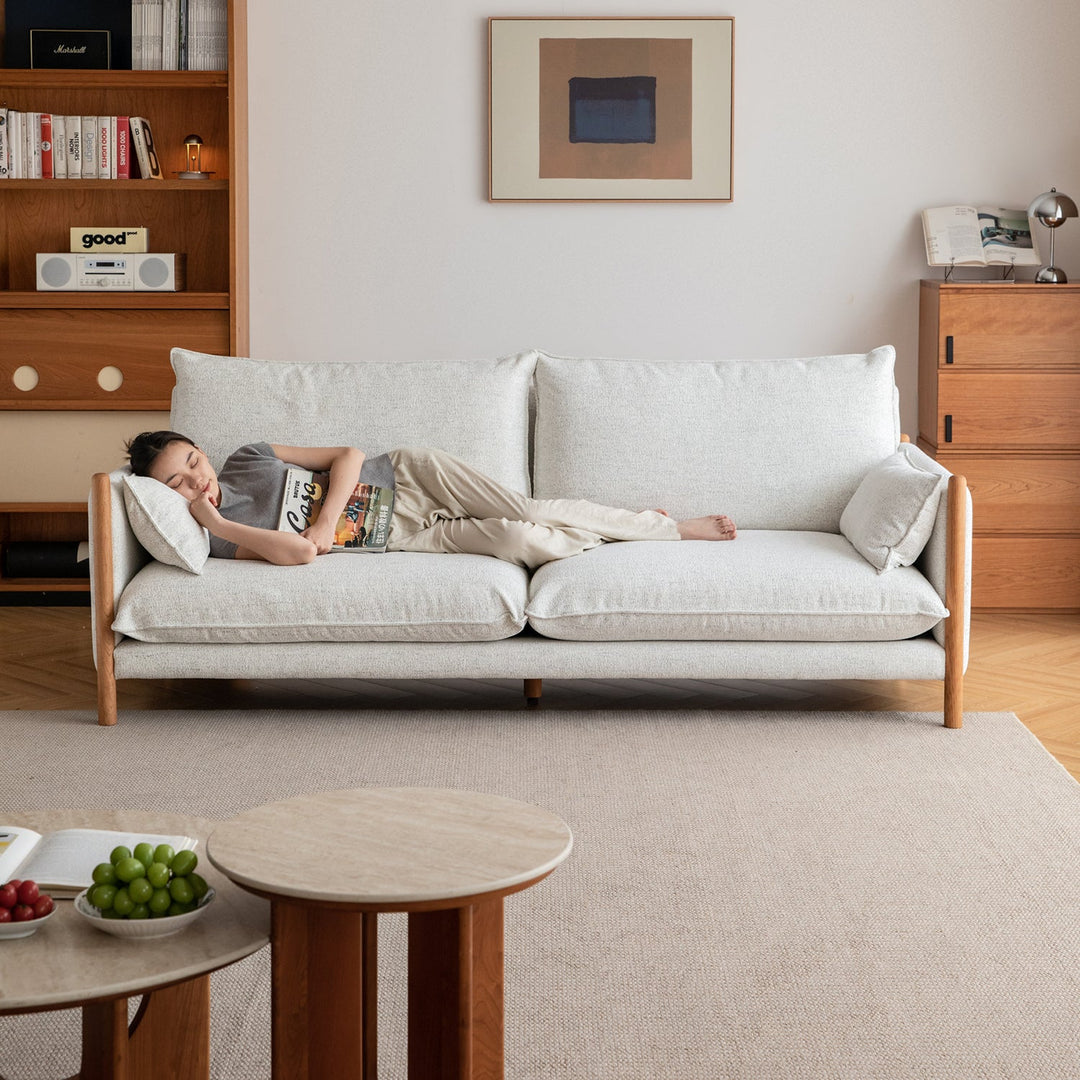 Scandinavian chenille velvet cherry wood 4 seater sofa sea salt in panoramic view.