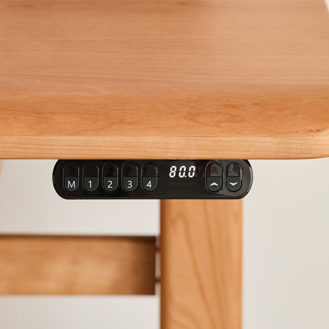 Scandinavian cherry wood electric height adjustable study table cloud lifting in still life.