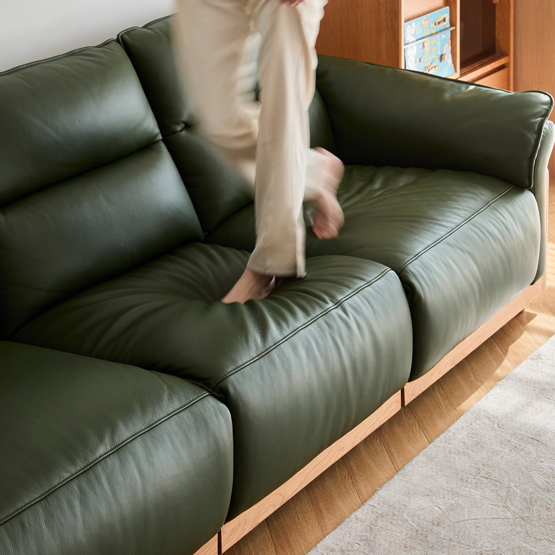 Scandinavian cherry wood genuine leather electric recliner 4 seater sofa edgeless in close up details.