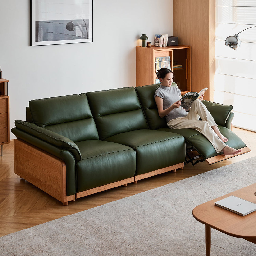 Scandinavian cherry wood genuine leather electric recliner 4 seater sofa edgeless in still life.