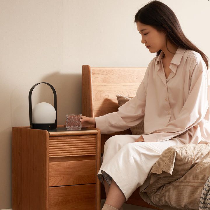 Scandinavian cherry wood side table auria in close up details.