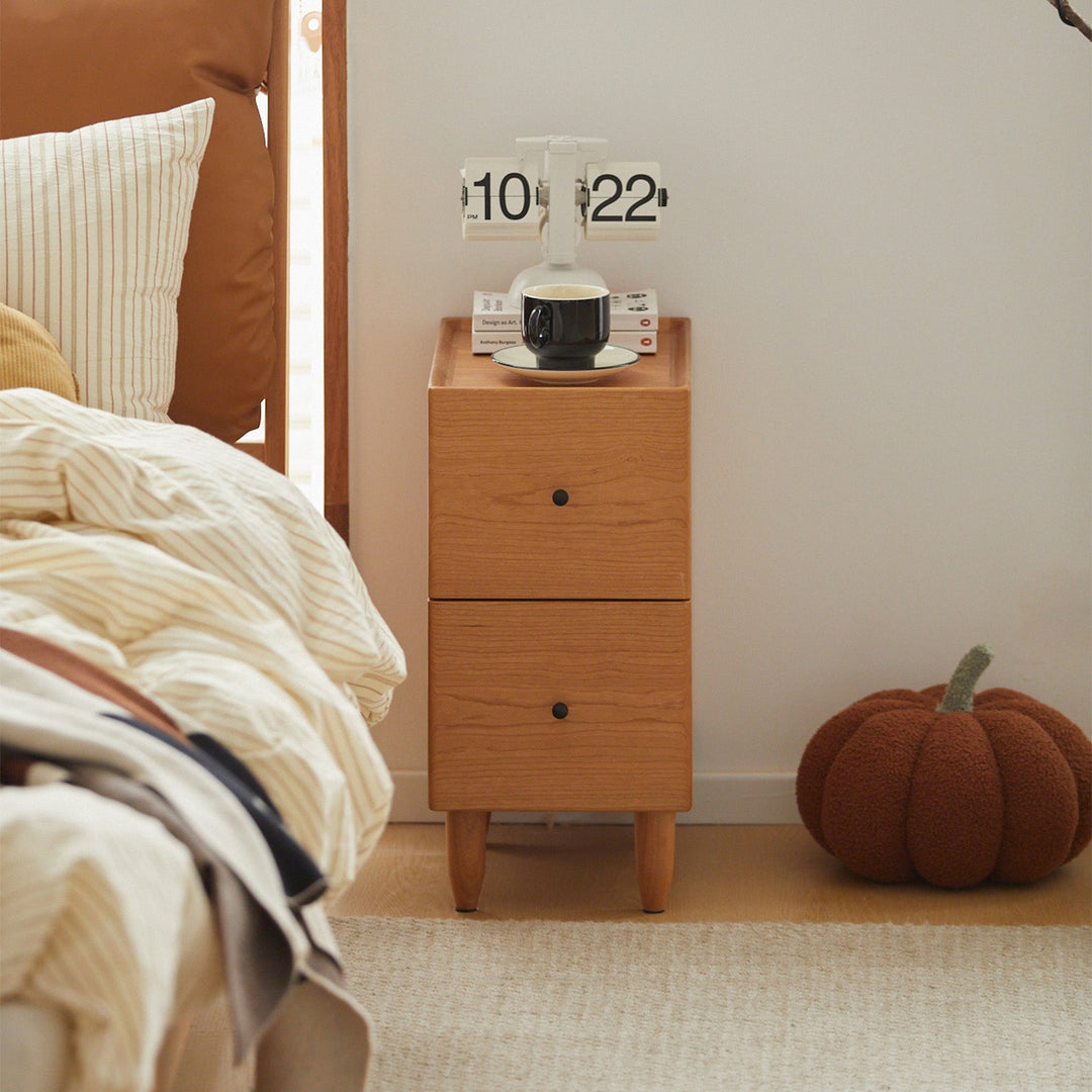 Scandinavian cherry wood side table cabo with context.