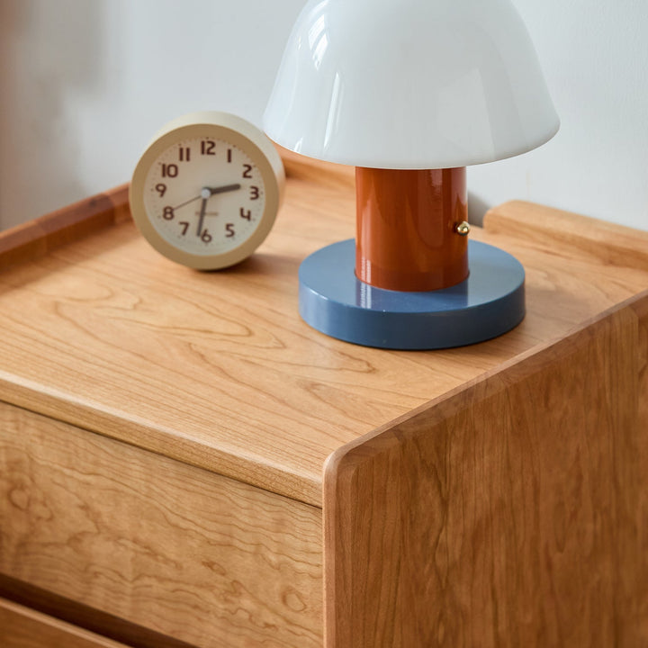 Scandinavian cherry wood side table vista in panoramic view.