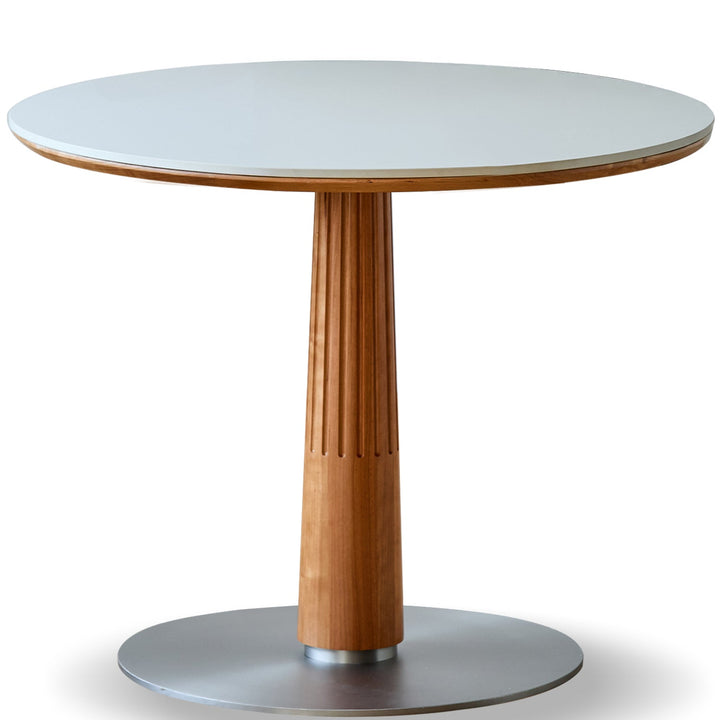 Round table with wooden pedestal and white top on a white background