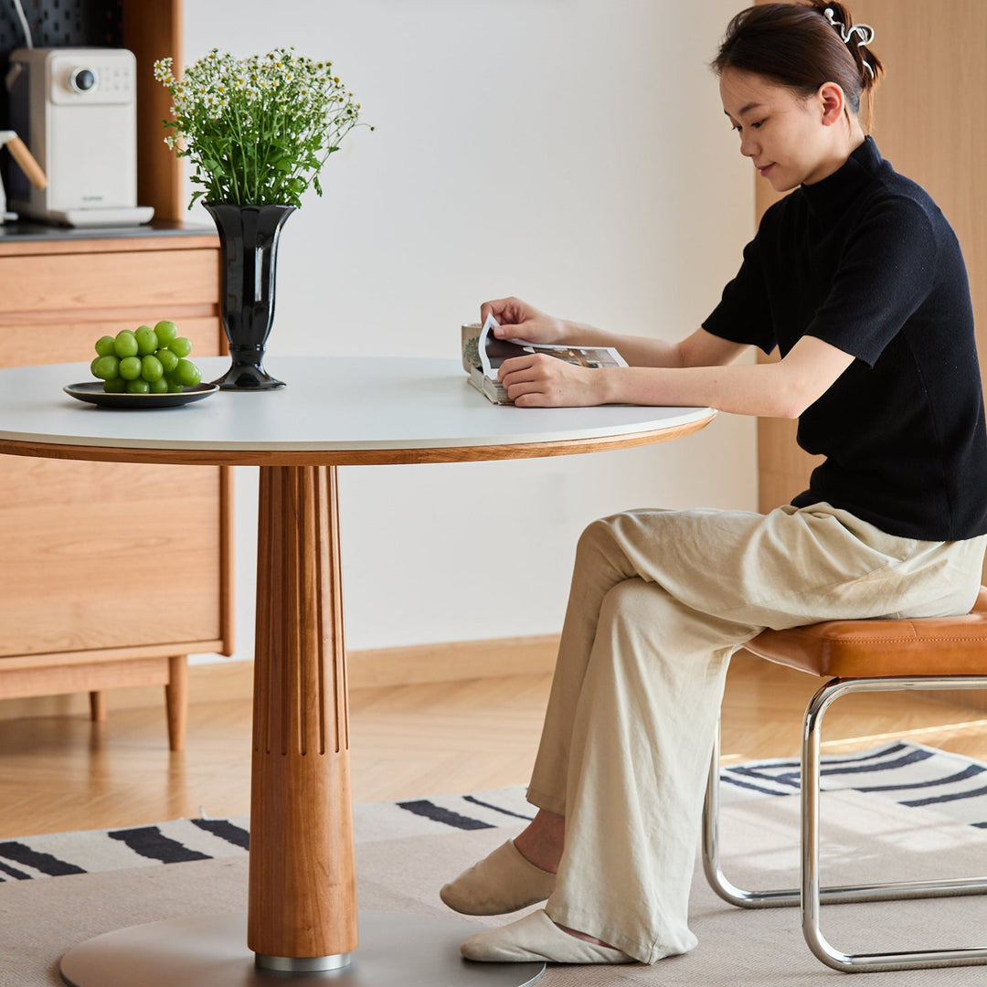 Scandinavian cherry wood sintered stone round dining table grey material variants.