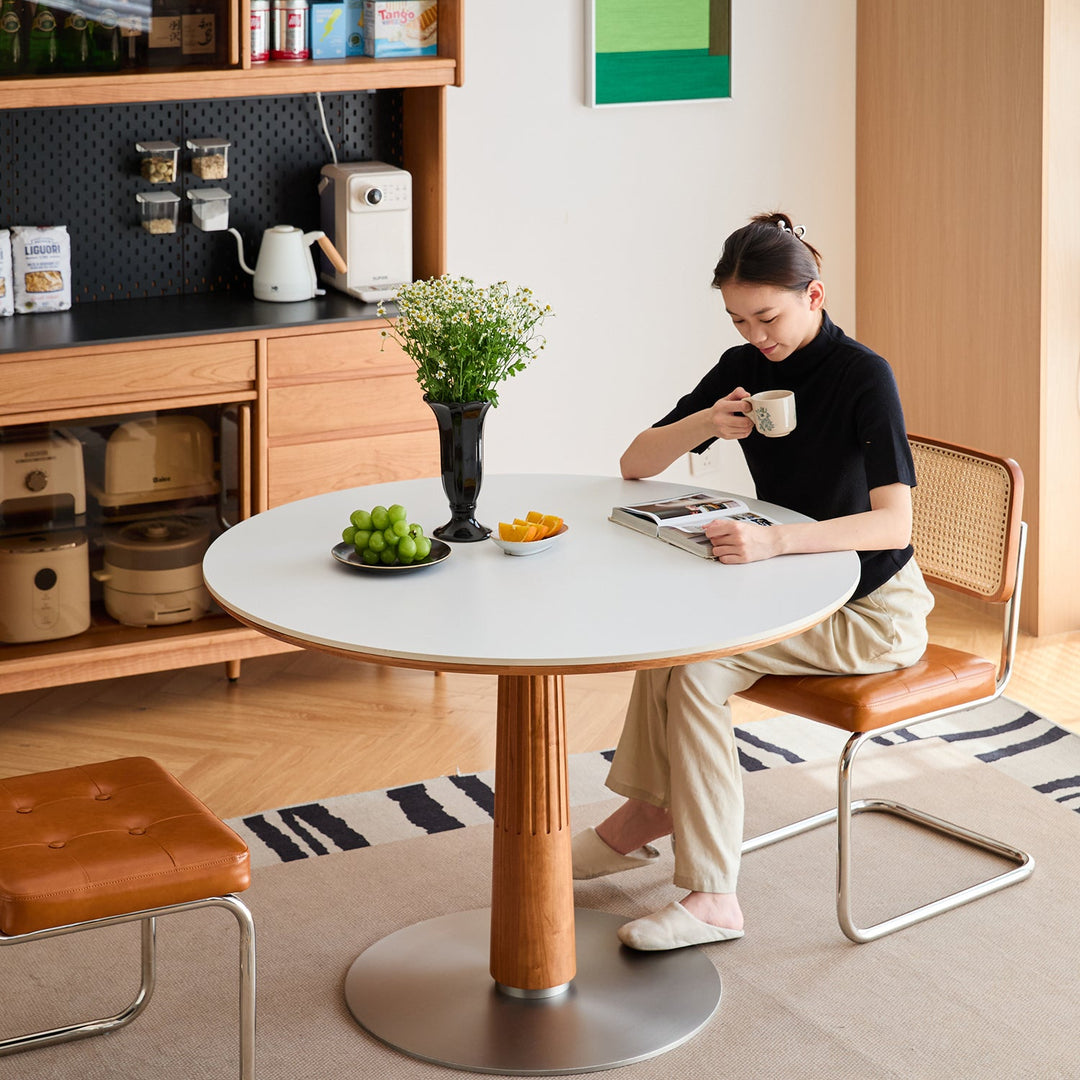 Scandinavian cherry wood sintered stone round dining table grey in details.