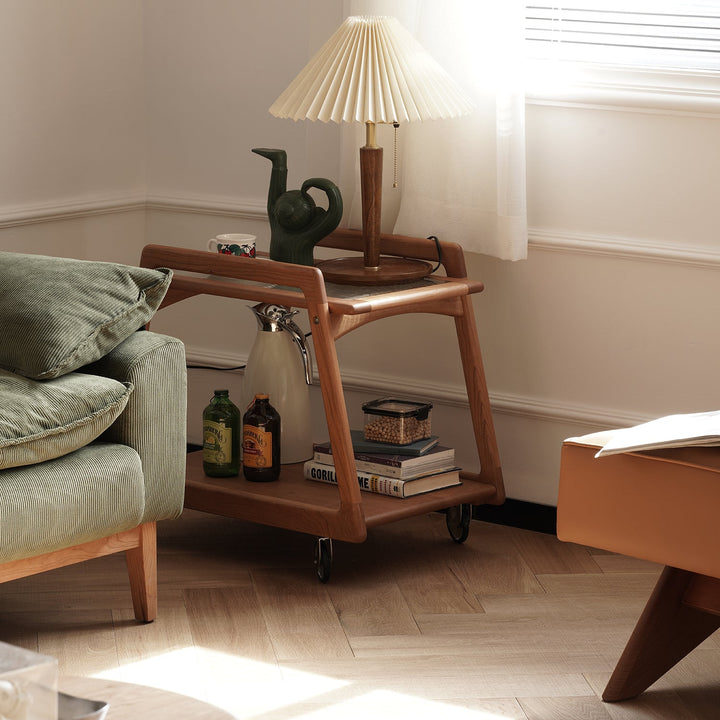 Scandinavian cherry wood wheeled trolley side table yoyo in still life.