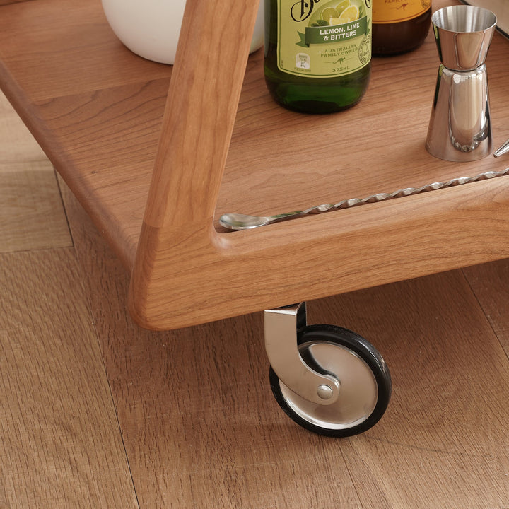 Scandinavian cherry wood wheeled trolley side table yoyo in real life style.
