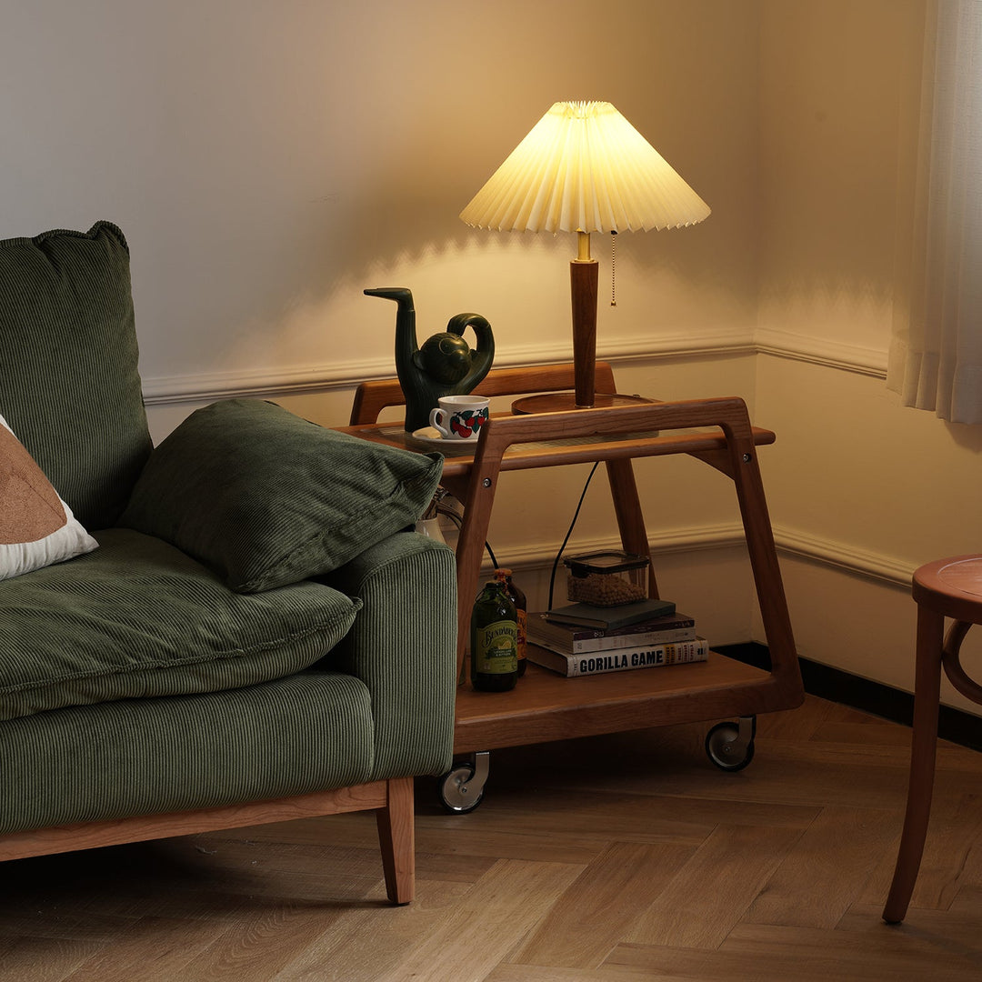 Scandinavian cherry wood wheeled trolley side table yoyo in close up details.