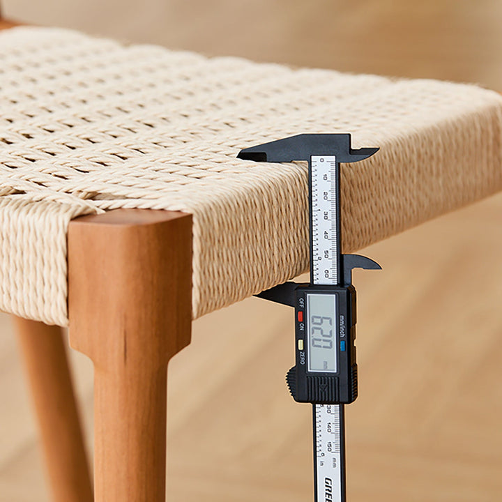 Scandinavian cherry wood woven rope dining chair sona in still life.