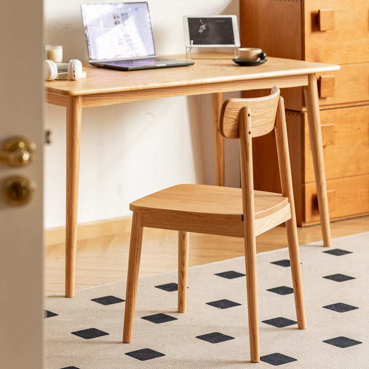 Scandinavian oak wood  dining chair green in panoramic view.