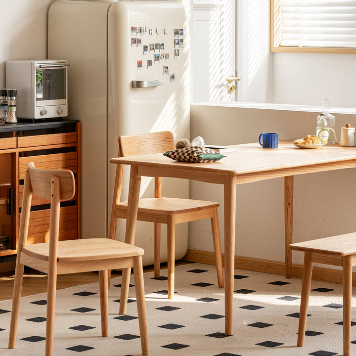 Scandinavian oak wood  dining chair green in close up details.