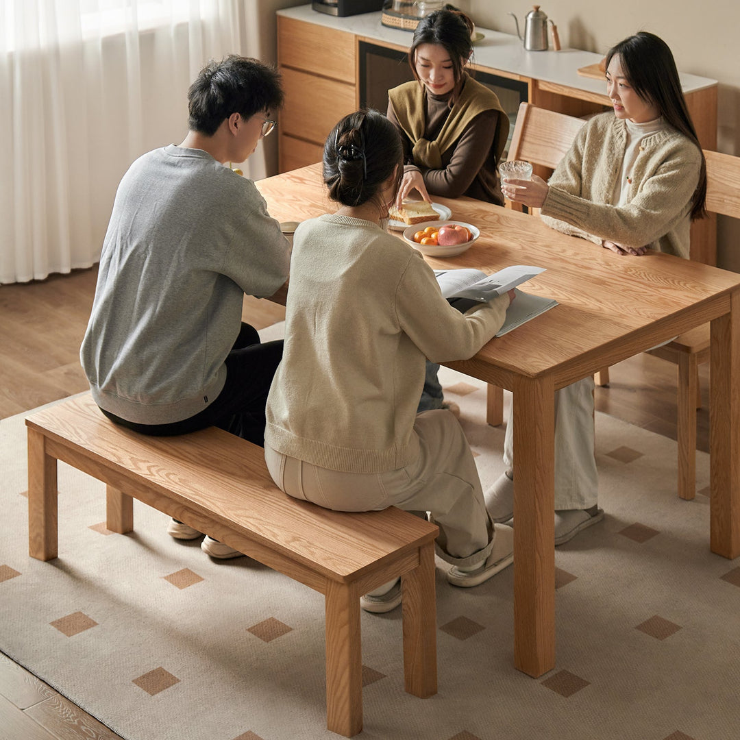 Scandinavian oak wood dining bench jamo with context.