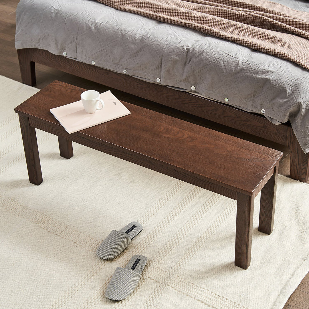 Scandinavian oak wood dining bench jamo in panoramic view.