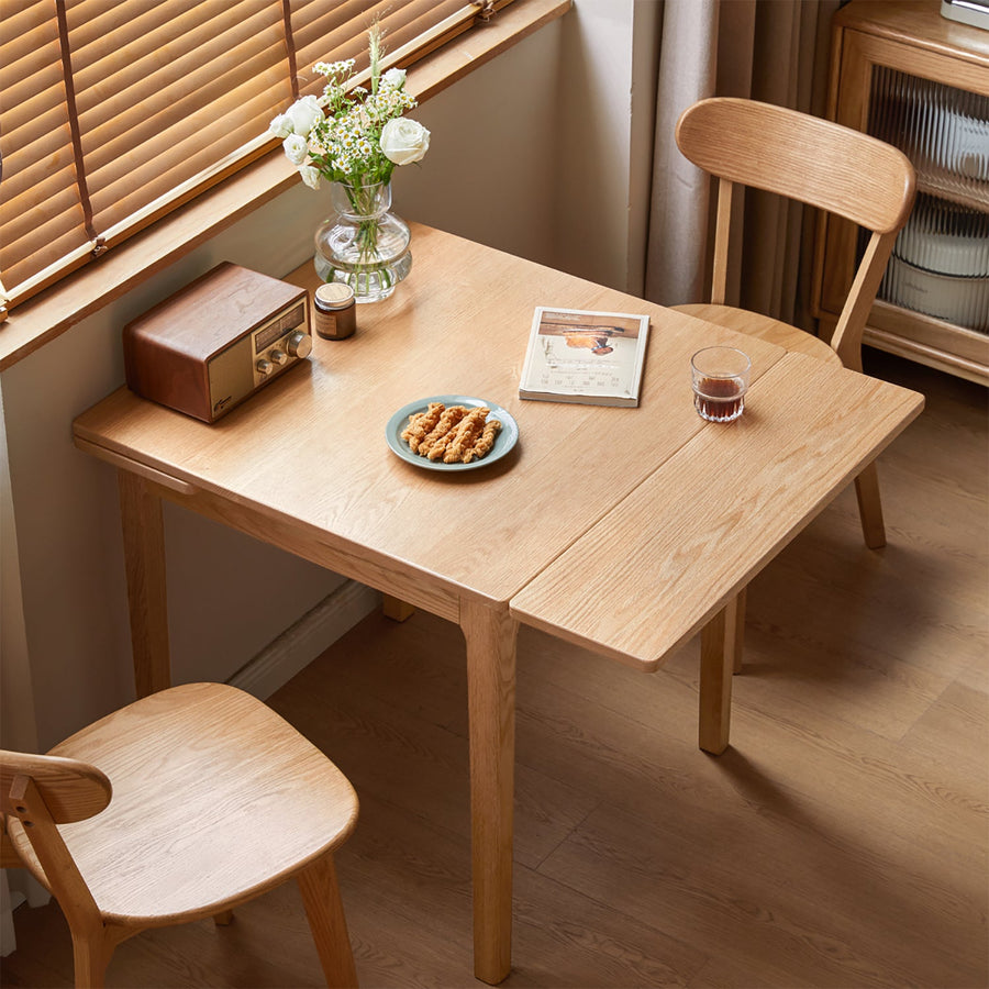 Scandinavian oak wood extendable dining table extendra primary product view.