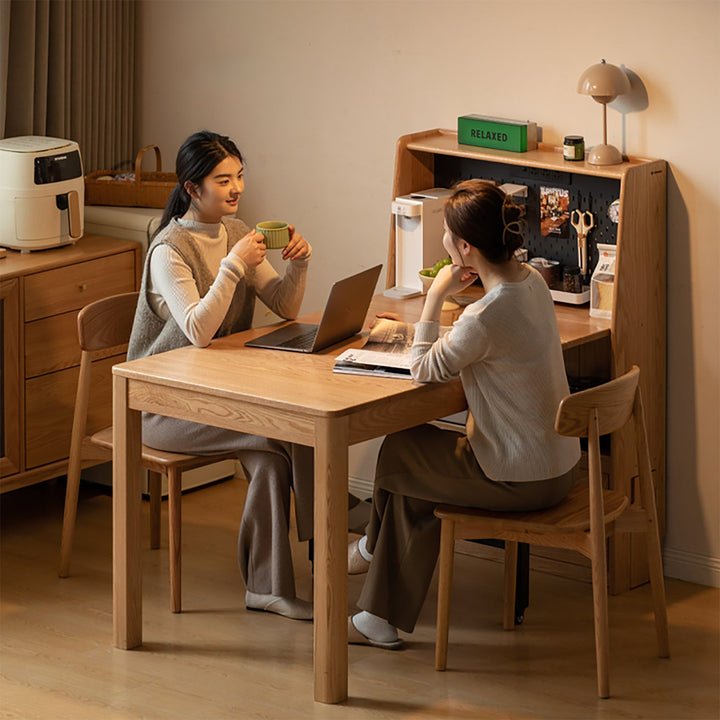 Scandinavian oak wood extendable dining table with shelf nest in real life style.
