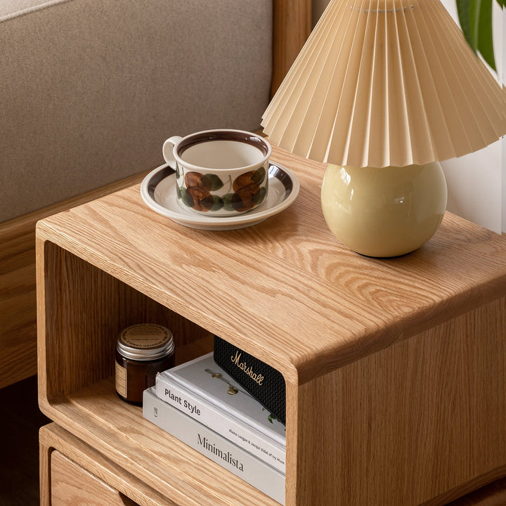 Scandinavian oak wood revolving side table twist in close up details.
