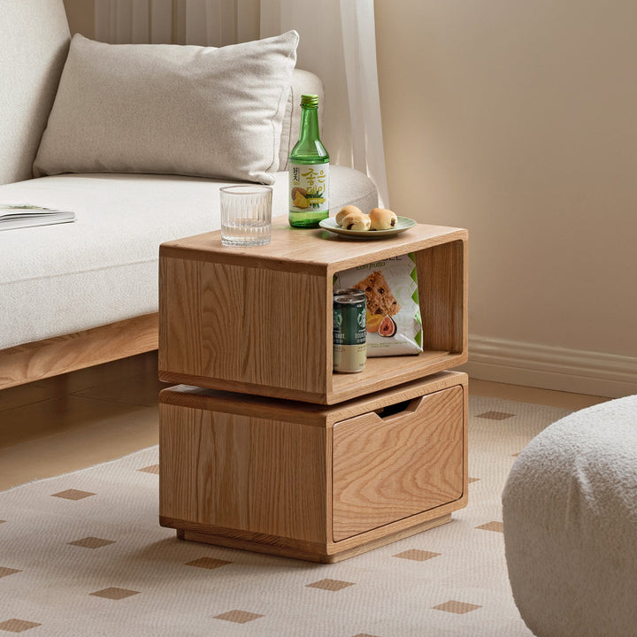 Scandinavian oak wood revolving side table twist in still life.
