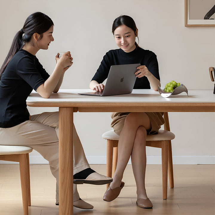 Scandinavian oak wood sintered stone dining table anchor with context.