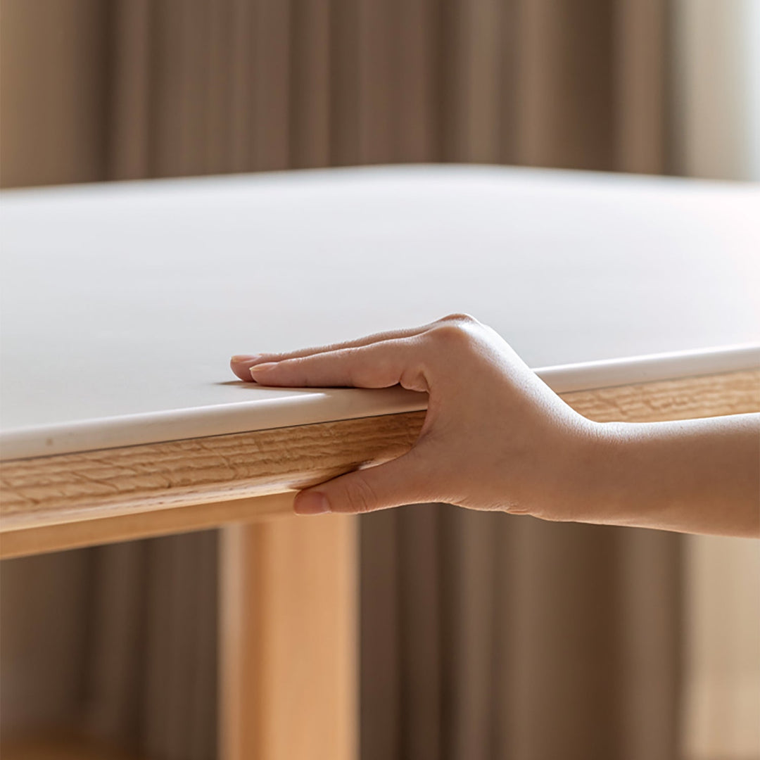 Scandinavian oak wood sintered stone dining table anchor in close up details.