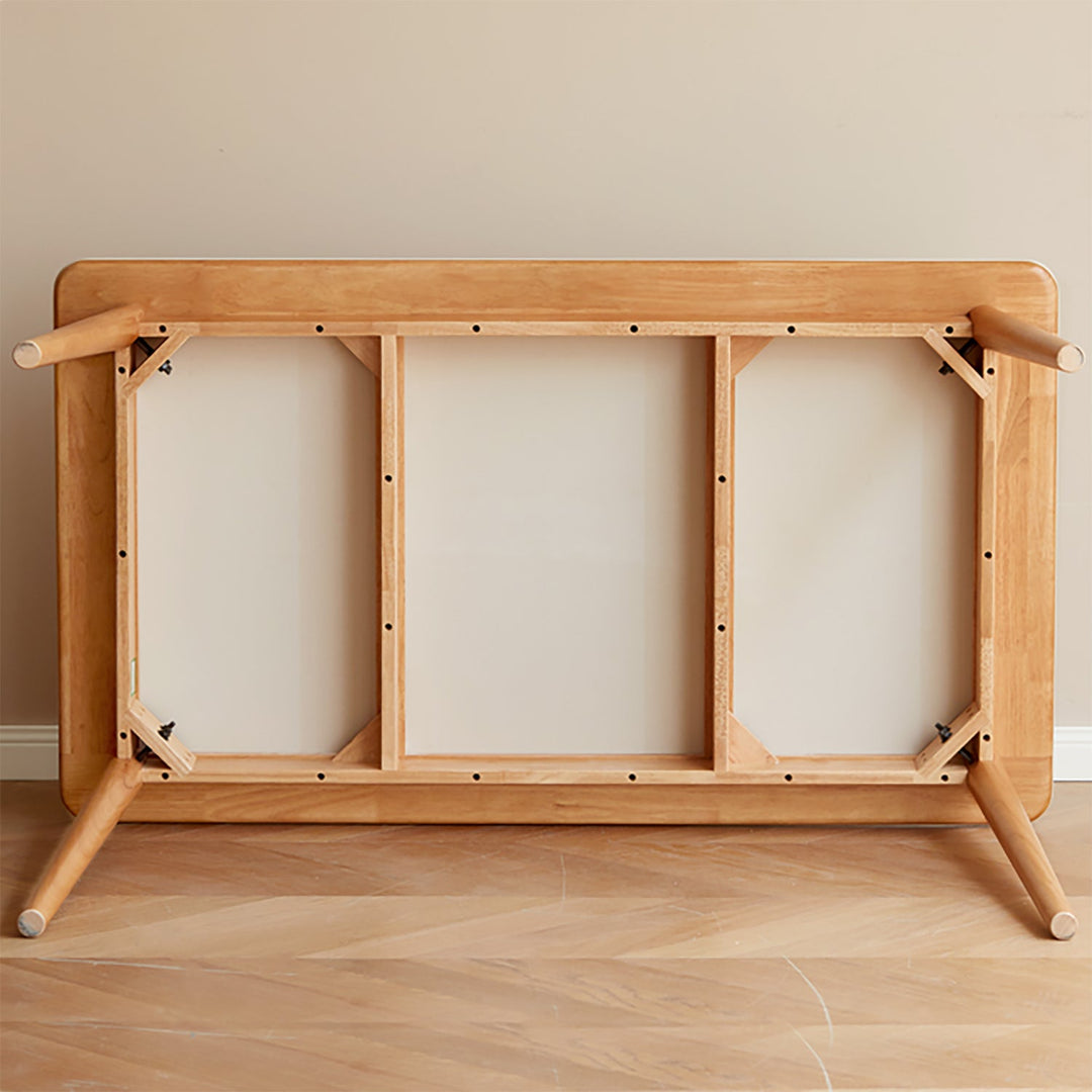 Scandinavian oak wood sintered stone dining table forme in still life.