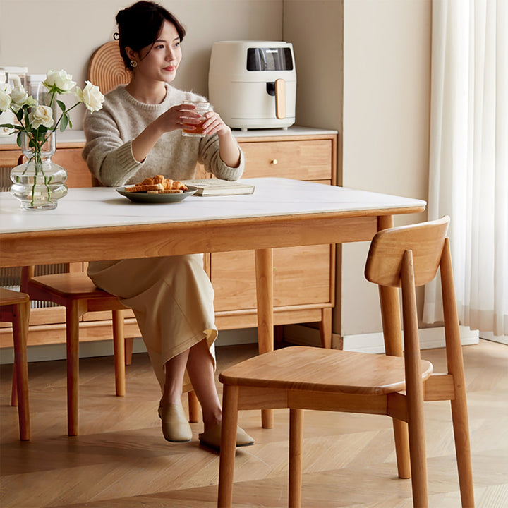 Scandinavian oak wood sintered stone dining table forme with context.
