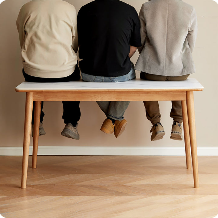 Scandinavian oak wood sintered stone dining table forme in panoramic view.