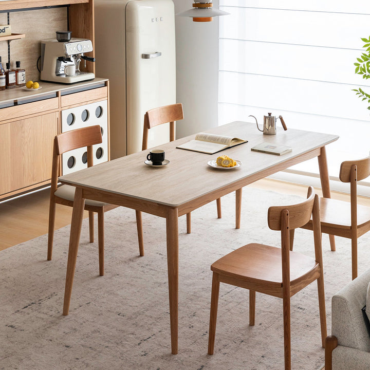 Scandinavian oak wood sintered stone dining table green with context.
