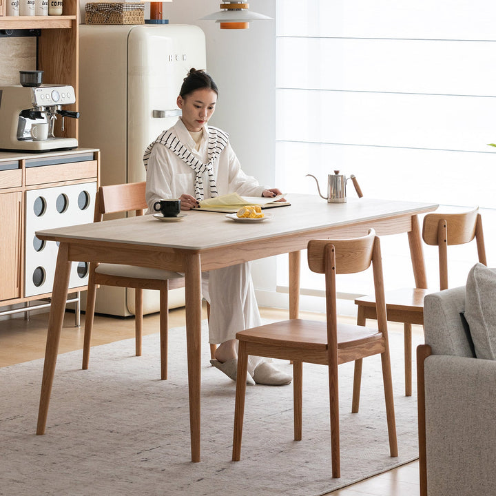 Scandinavian oak wood sintered stone dining table green in panoramic view.