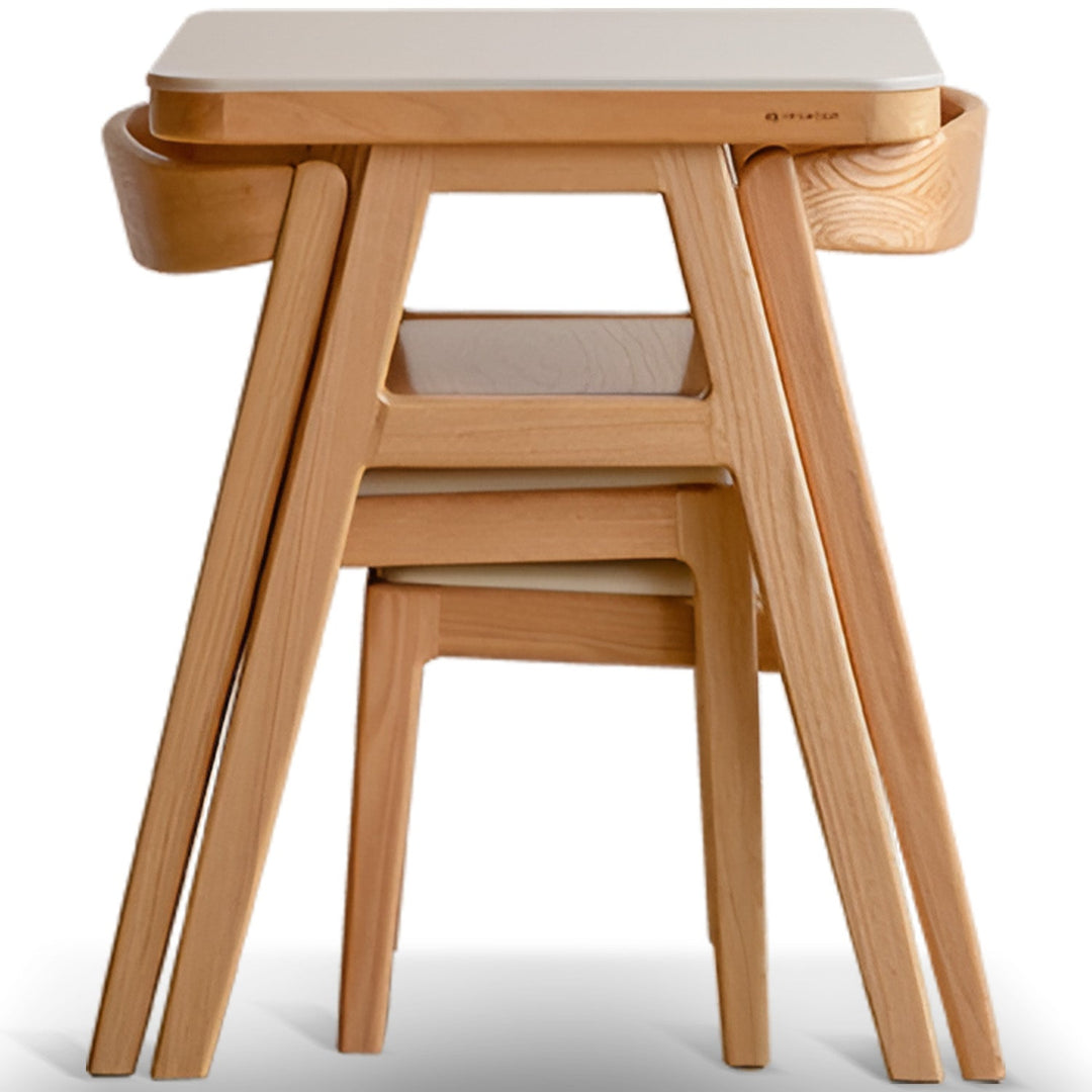 Scandinavian oak wood sintered stone stackable dining table set noki in white background.