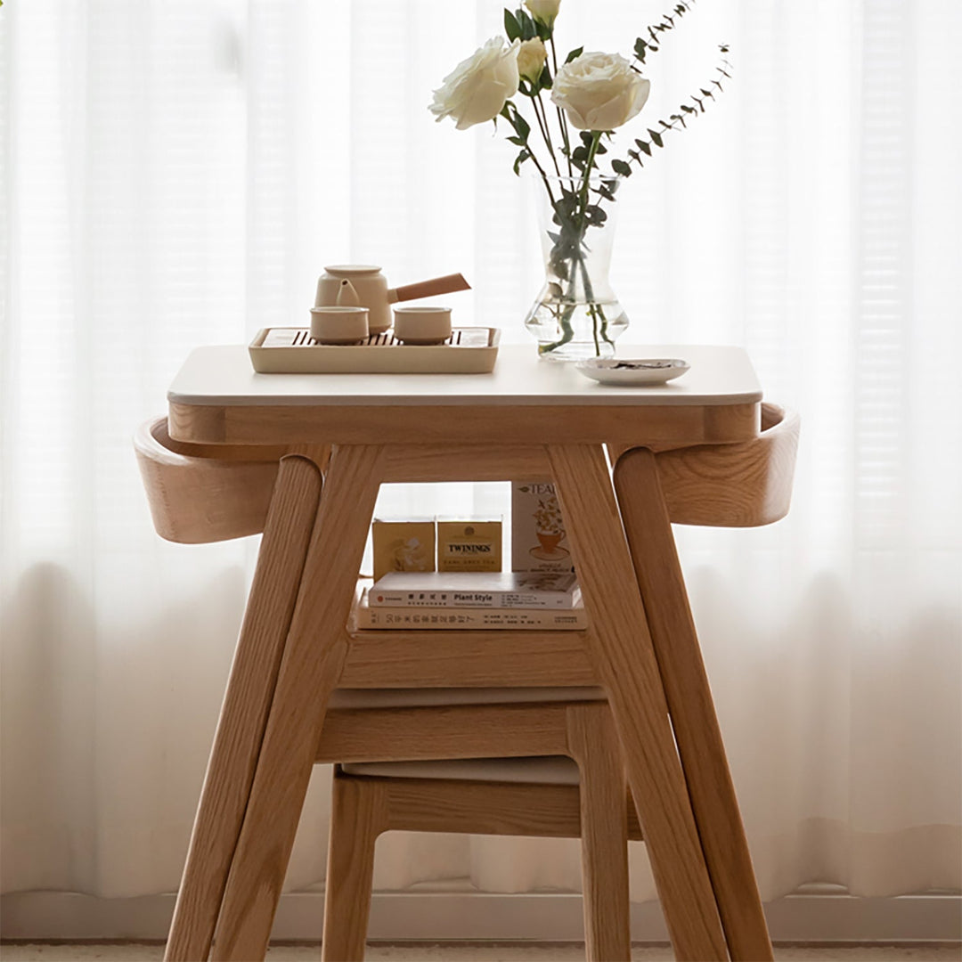 Scandinavian oak wood sintered stone stackable dining table set noki with context.
