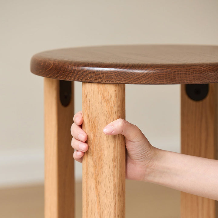 Scandinavian oak wood stackable stool with wheels friday in still life.