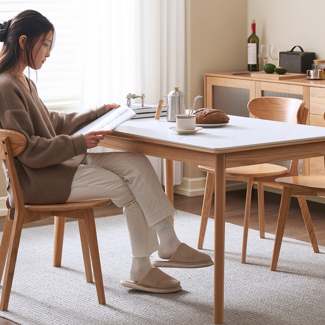 Scandinavian sintered stone oak wood dining table jaden with context.