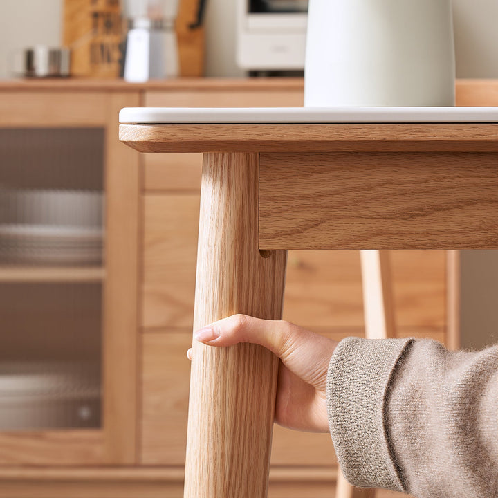 Scandinavian sintered stone oak wood dining table jaden in close up details.