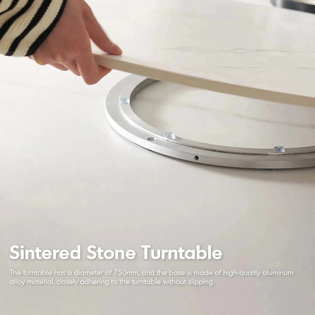Scandinavian sintered stone round dining table belly with context.