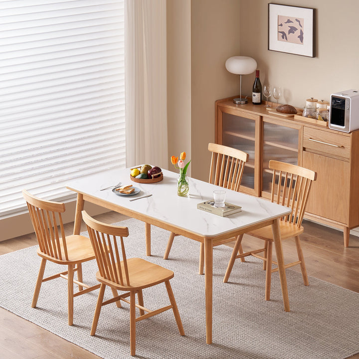 Scandinavian sintered stone rubber wood dining table rowan with context.
