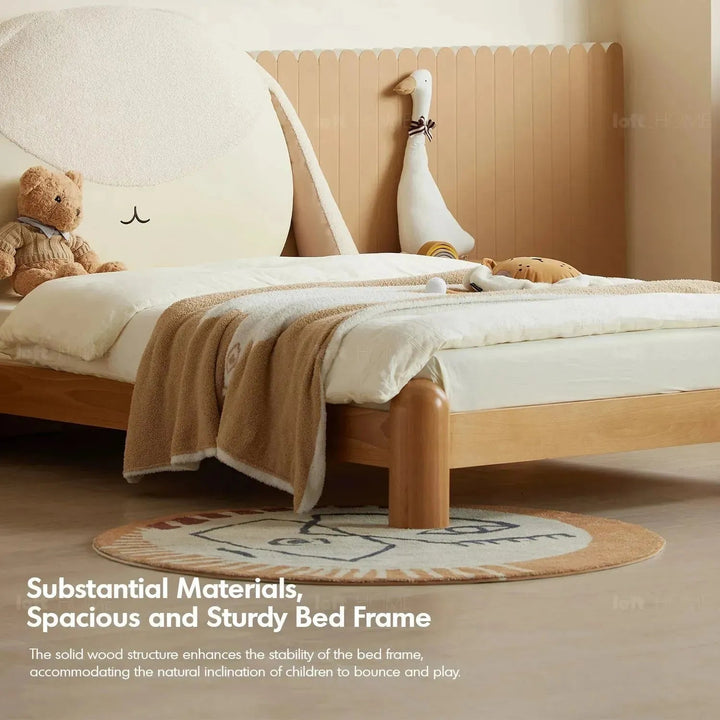 Cream wood kids bed bunny in panoramic view.