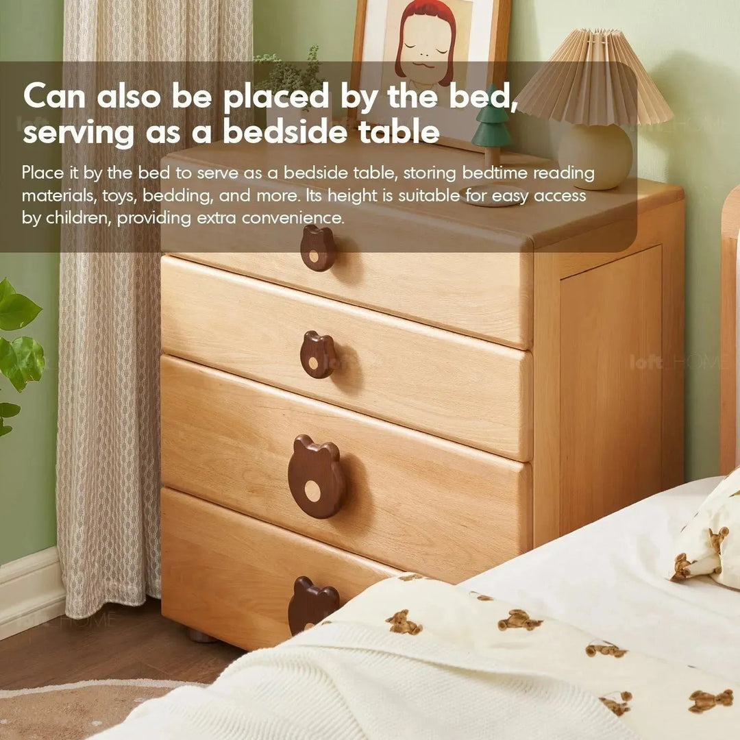 Scandinavian wood kids drawer cabinet teddy in close up details.