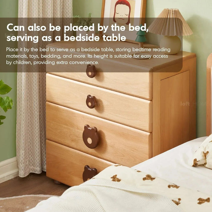 Scandinavian wood kids drawer cabinet teddy in close up details.