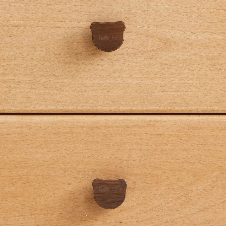 Scandinavian wood kids side table bear in close up details.