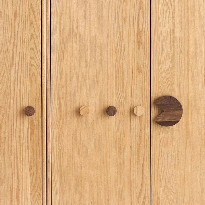 Scandinavian wood kids wardrobe pacman in close up details.