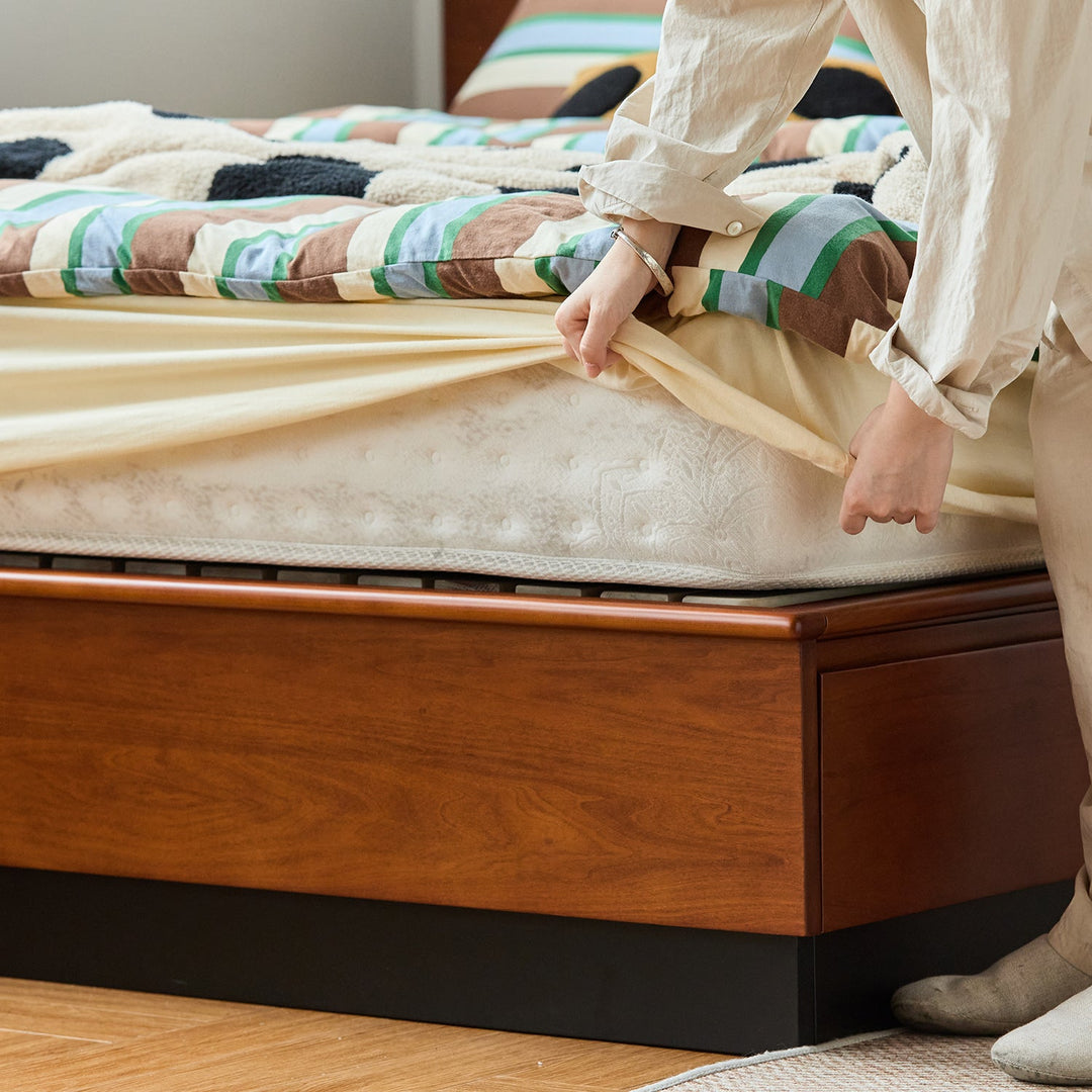 Vintage boxwood lift-up storage platform bed with drawer wheat field in panoramic view.